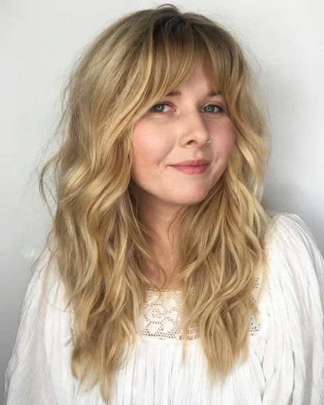 Tousled Blonde Layers with Wispy Bangs