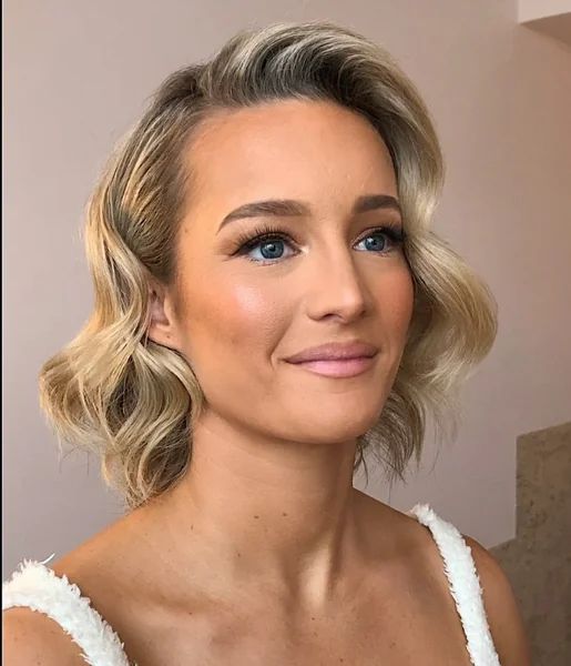 Glamorous Wavy Bob with Side-Swept Volume