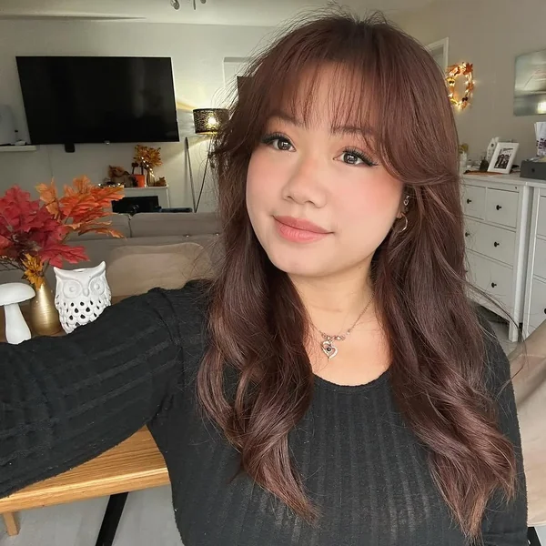 Long Auburn Layers with Soft Bardot Bangs