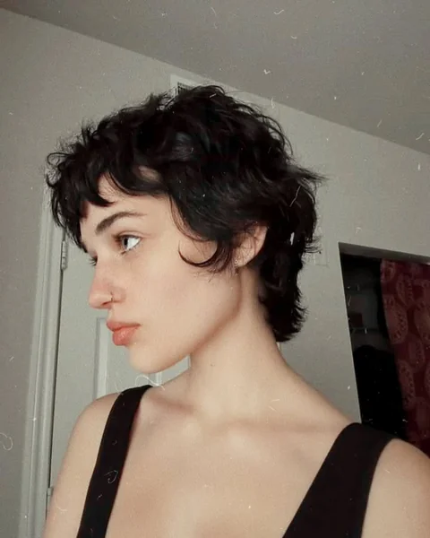Messy Dark Pixie Cut with Curly Fringe