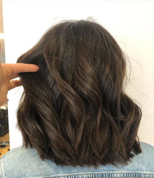 Polished Shoulder-Length Lob for Thick Chocolate Waves
