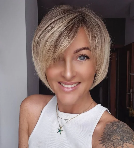 Sleek Blonde A-Line Bob with Deep Side Bangs