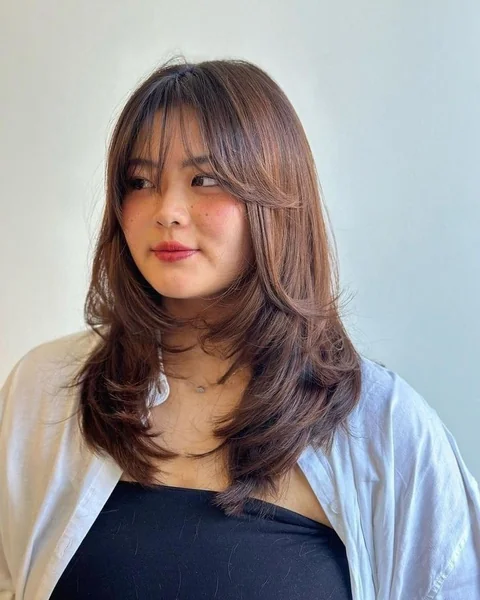 Voluminous Layered Hush Cut with Curtain Bangs