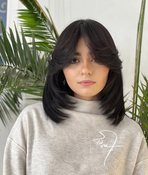 Dark Lob with Bold, Voluminous Face Layers