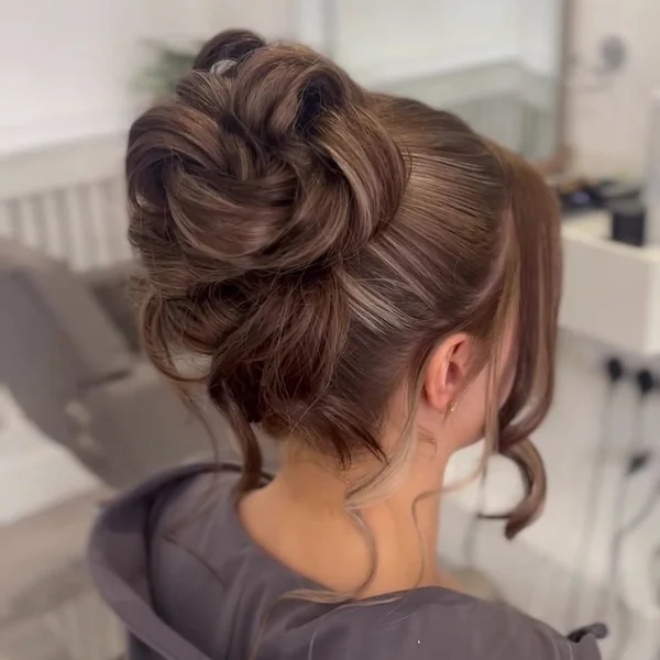 Dimensional High Bun Updo with Curled Swirls