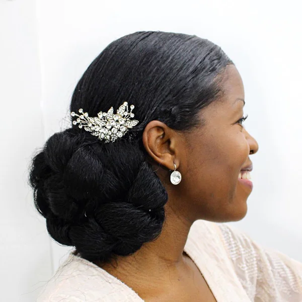 Elegant Low Twisted Bun with Sparkling Crystal Accent