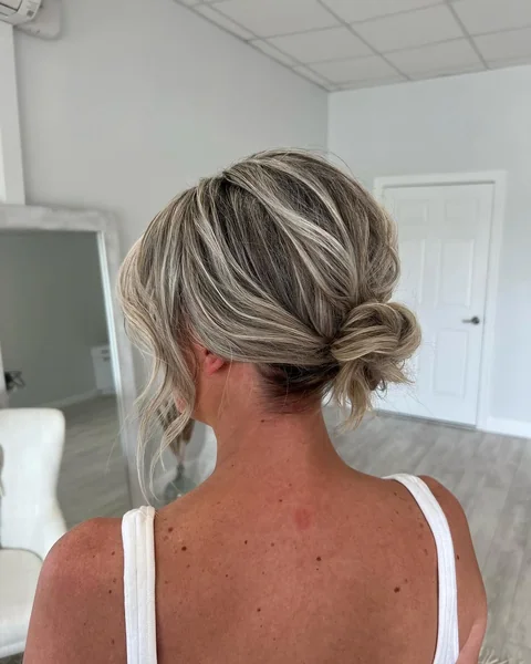 Messy Low Textured Bun for Short Blonde Hair