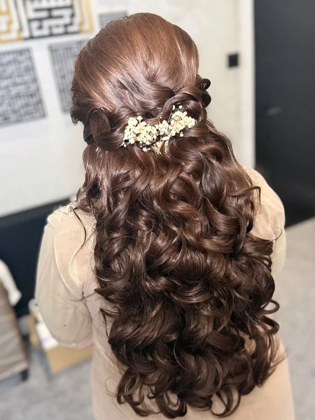 Rich Brunette Curls with Delicate Floral Half-Up Style