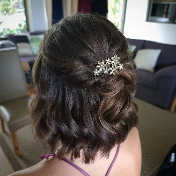 Romantic Half-Up Hairstyle with Wavy Lob and Clip