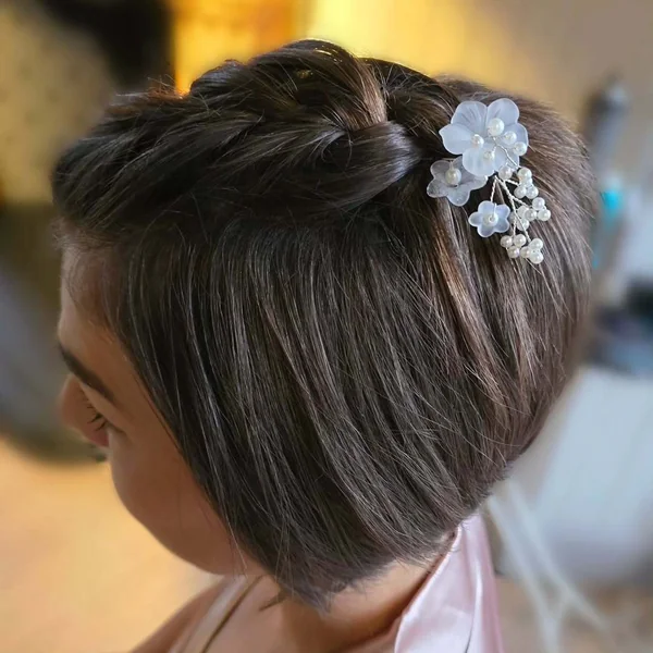 Sleek Inverted Bob with Twisted Crown and Flower Pins