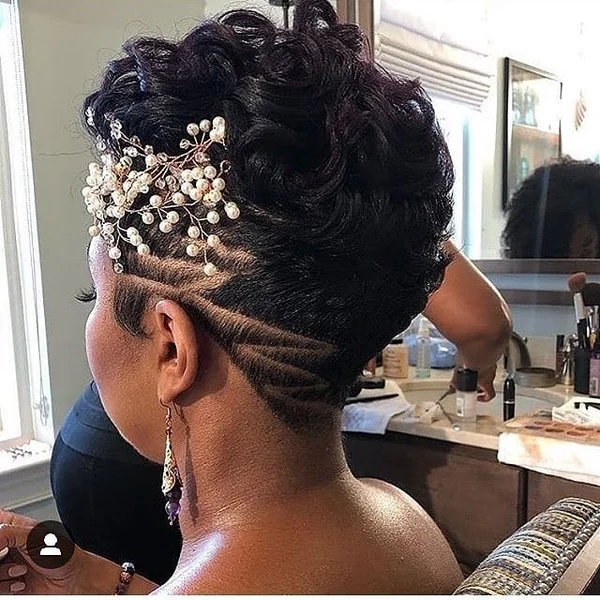 Voluminous Curly Pixie with Intricate Undercut Design