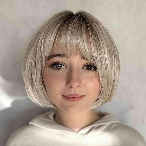 Chic Champagne Blonde Rounded Bob with Airy Fringe