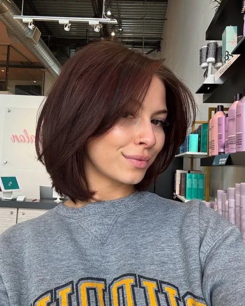 Chic Mahogany Volumized Bob with Soft Curtain Bangs