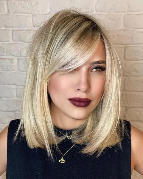 Chic Vanilla Blonde Lob with Dramatic Side Bangs
