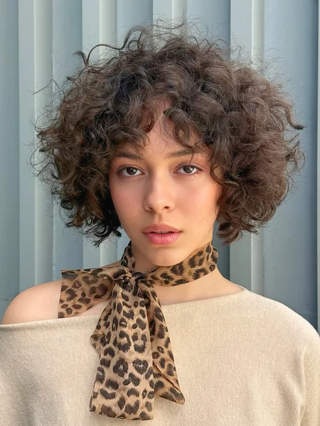 Curly Dark Brunette Bob with Choppy Fringe