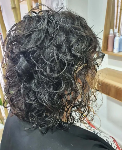 Dark Wet-Look Curly Bob with High Volume