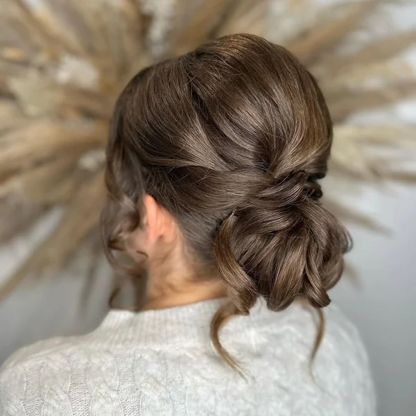 Edgy High Bun with Swooping Side Bangs