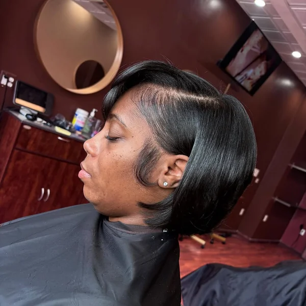 Edgy Sculpted Bob with Tapered Layers and Side-Swept Bangs