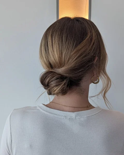 Effortless Twisted Low Bun in Blonde Balayage