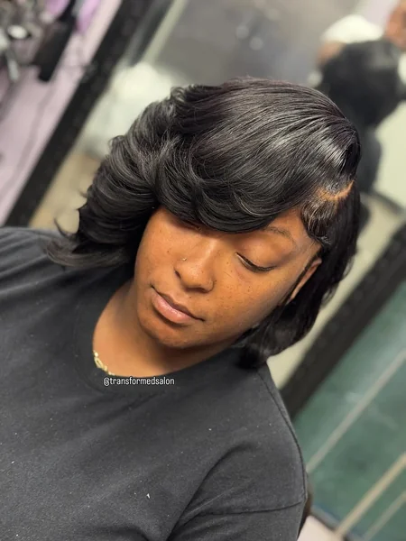 Feathered Jet-Black Bob with Dramatic Swept Layers