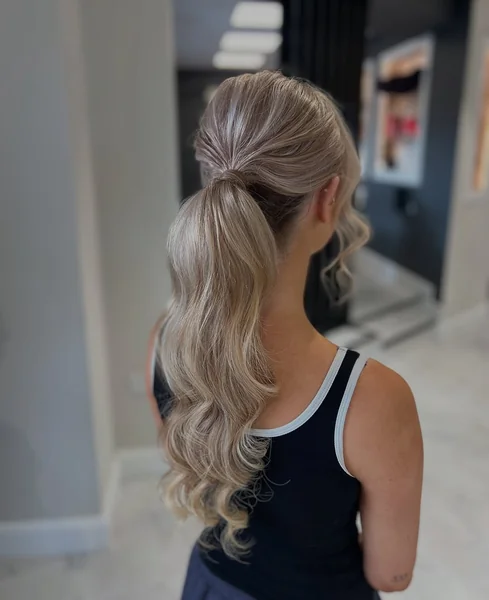Glamorous Voluminous High Ponytail with Curls