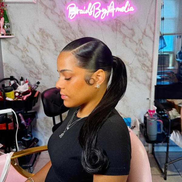Glossy Black Ponytail with Feathered Ends and Edges