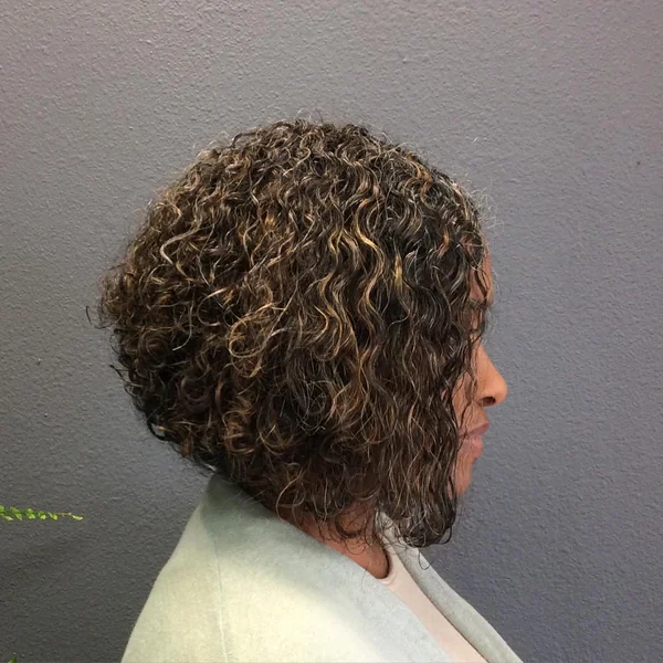 Layered Warm-Toned Curly Bob with Defined Coils