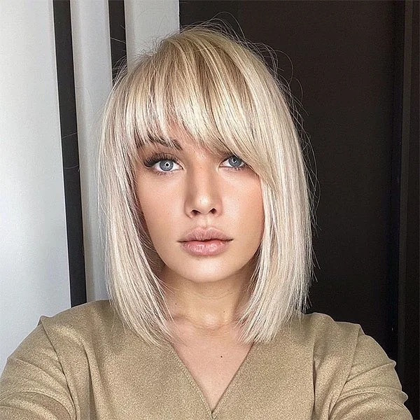 Piecey Champagne Blonde Lob with Side-Swept Bangs