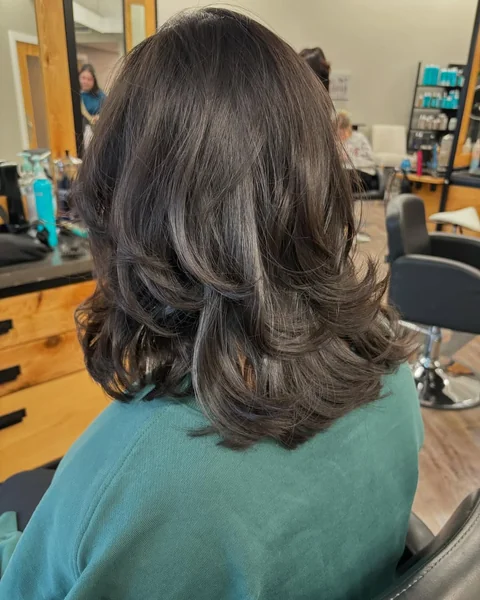 Shoulder-Skimming Brunette Layers with Soft Flipped Bangs