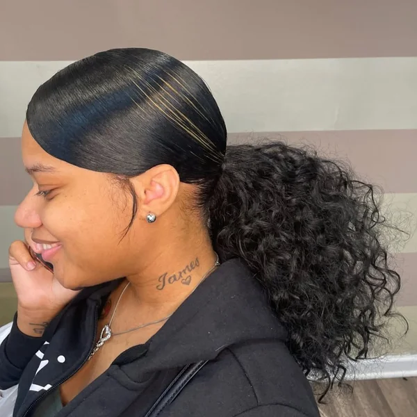 Sleek Side-Swoop Ponytail with Honey Streaks and Curls