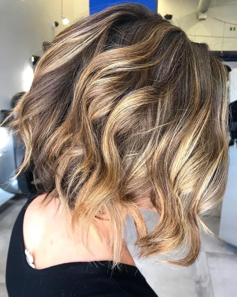 Sun-Kissed Textured Lob with Bright Face-Framing Highlights
