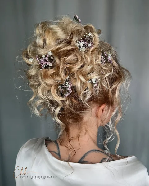 Voluminous Honey-Highlighted High Bun with Curtain Bangs