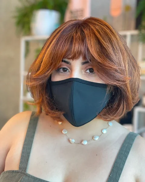 Voluminous Copper Messy Bob with Wispy Bangs