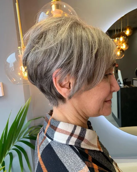 Voluminous Curly Pixie Bob with Tapered Sides