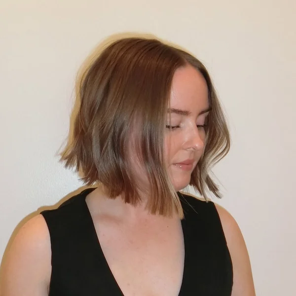 Wavy Mid-Length Layered Bob with Volume