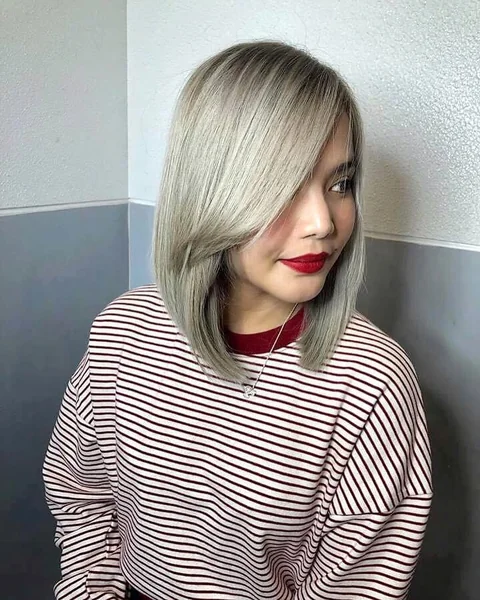 Sleek Auburn Lob with Face-Framing Wispy Layers