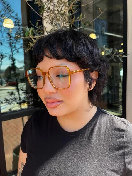 Airy Honey-Blonde Pixie with Voluminous Swept Layers