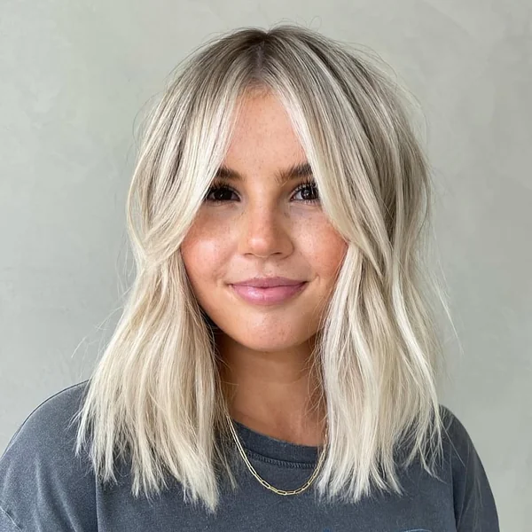 Bright Platinum Long Angled Bob with Soft Curtain Bangs