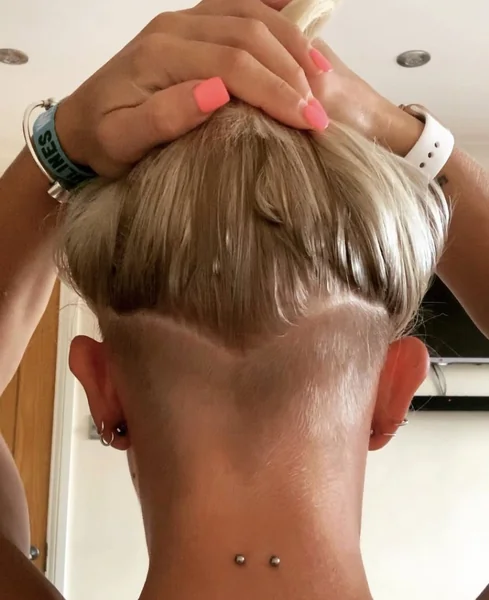 pixie haircut with undercut and bangs