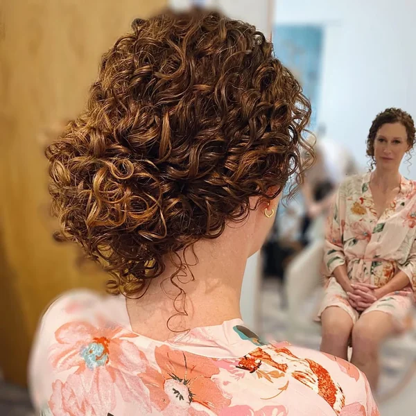 Copper Curly Low Bun for Special Occasions