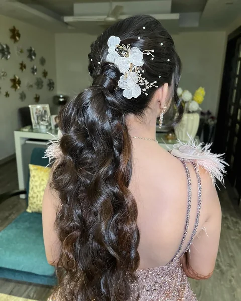 Glamorous Braided Ponytail with Voluminous Cascading Waves