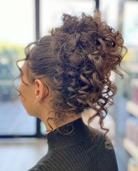 High-Volume Curly Pineapple Updo with Ringlet Fringe