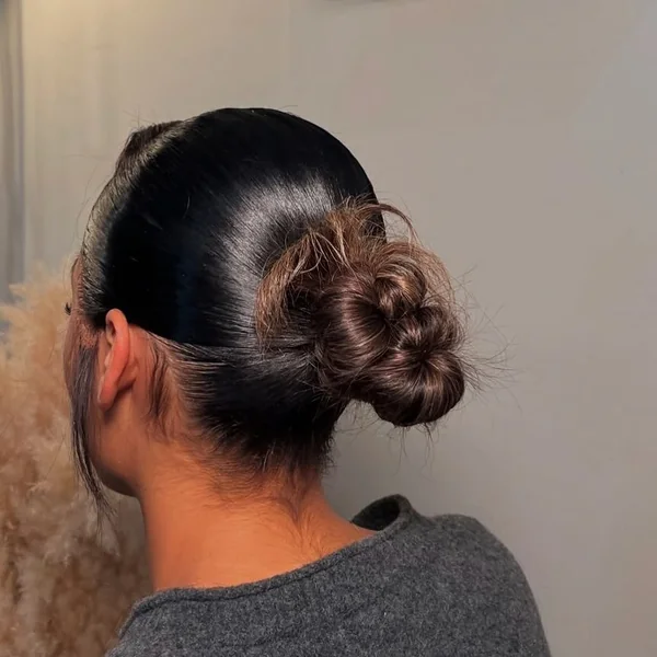 High Voluminous Curly Bun with Wispy Fringe