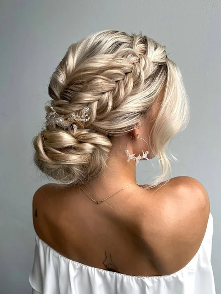 Intricate Braided Low Bun with Floral Crystal Accents