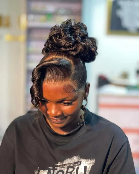 Intricate Feed-In Braided High Bun with Golden Highlights