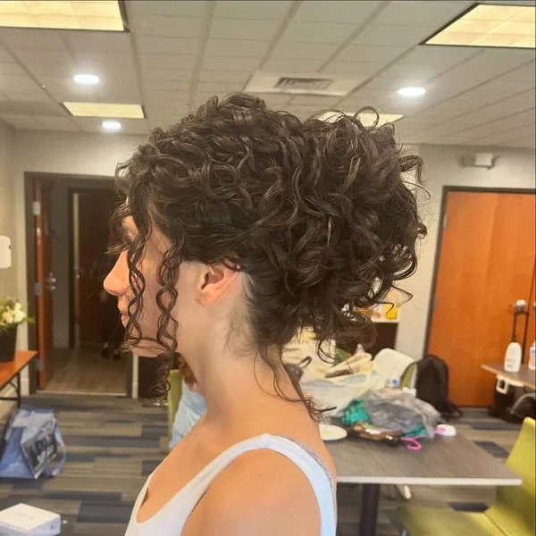 Modern Curly Mohawk Updo with Side Taper