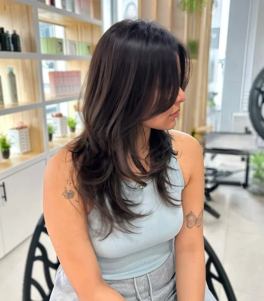Polished Sleek High Pony with Sculpted Curls
