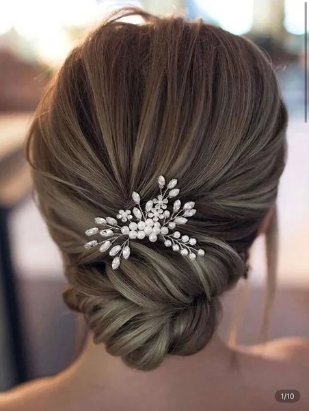 Relaxed Sandy Blonde Low Bun with Tousled Waves