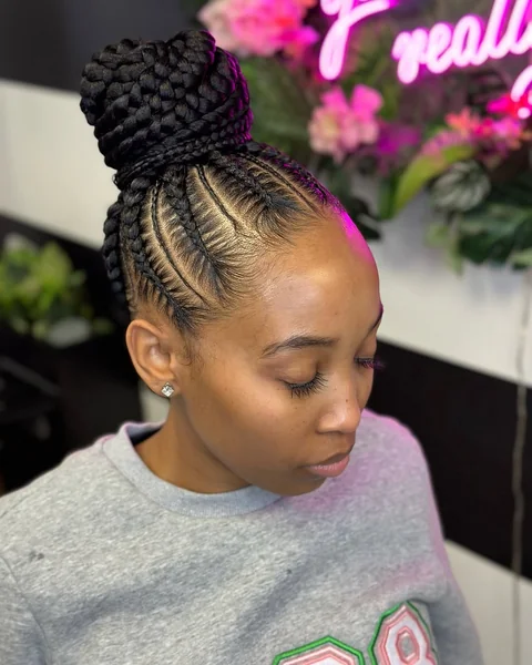 Sculpted High Bun with Sleek Dramatic Side Swoop