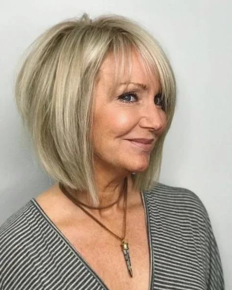 Sleek Champagne Blonde Bob with Wispy Fringe